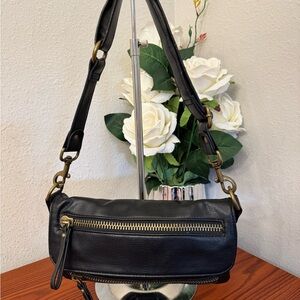 Luxurious Black and Gold Shoulder Bag with Textured Leather